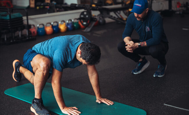 A marathon runner training with his trainer.