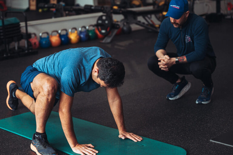 A marathon runner training with his trainer.