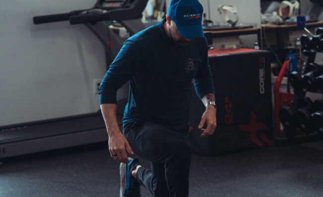 Personal trainer doing lunges.