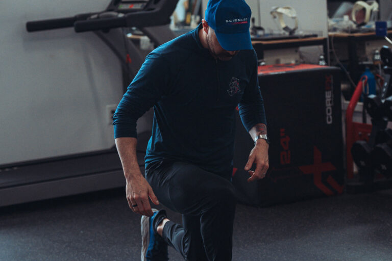 Personal trainer doing lunges.